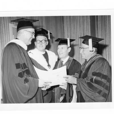 William F. Maloney, S.J., Jerome B. Coll, S.J., and John J. Coniff, S.J. with honorary degree recipient, William F. Kellow, during September 1967 graduation/commencement.