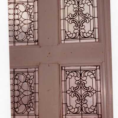 Interior view of leaded windows in stairway of Wolfington Center (formerly Gest Estate, Neumann Hall).