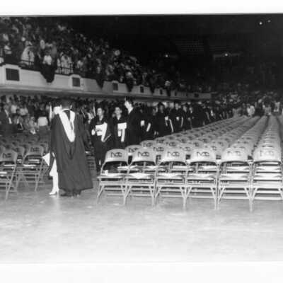 Graduates processing into Convention Hall, Philadelphia Civic Center during 1990 graduation/commencement.