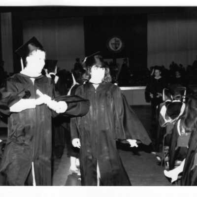 Views of small groups of graduates after receiving their diplomas.