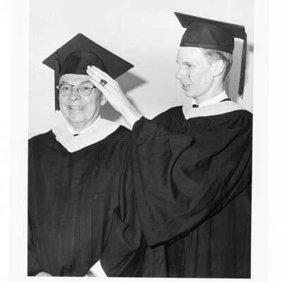 Two graduates, Alfred Baker and Thomas F. Finnegan, during 1966 graduation/commencement.