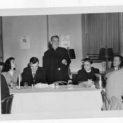 The Hawk student newspaper dinner with John J. Long, S.J. and others.