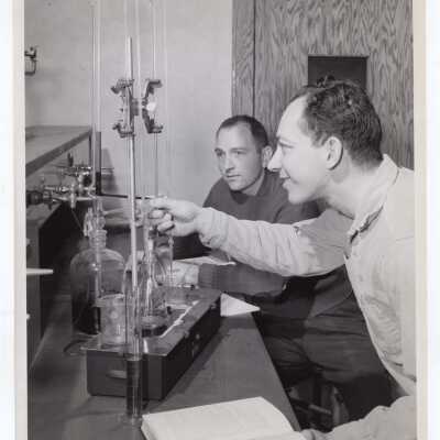 Chemistry graduate students, Harry Otterson and Godfrey Forman, in new graduate science laboratory, February 1958.