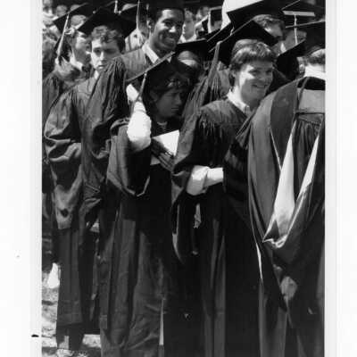Graduates processing onto Gest Lawn during graduation/commencement, c. 1985.