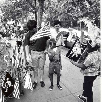 Students from "The House" or SJC Commune at 17th and Girard Streets, Philadelphia, with neighborhood children at street fair.