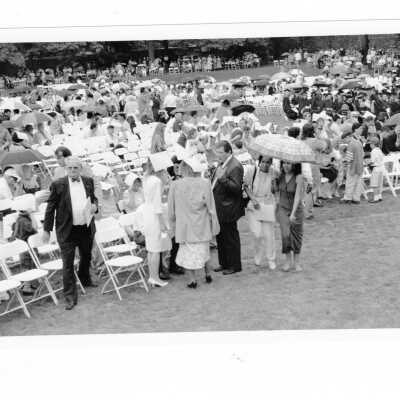 View of 1993 graduation/commencement ceremony on Gest Lawn ending in rain.