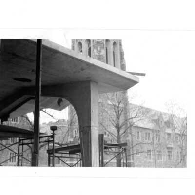 Front entry of Drexel Library with scaffolding and Barbelin in background.