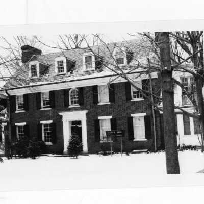 View of front of Xavier Hall with snow on ground.