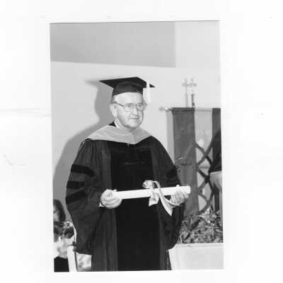 Views of honorary degree recipient, Prime Minister of Ireland, Albert Reynolds, with Nicholas S. Rashford, S.J., during convocation, October 6, 1994.