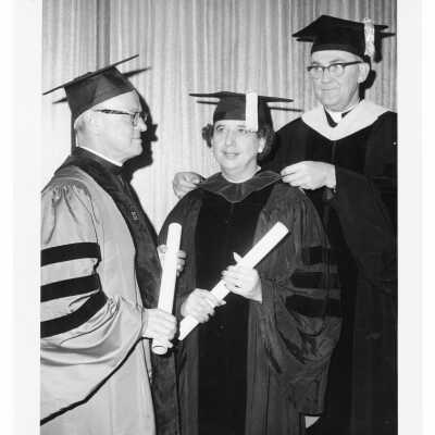 William F. Maloney, S.J., with two honorary degree recipients, Joseph A. Flaherty, O.S.A. and Genevieve Blatt, at October 1965 graduation/commencement.