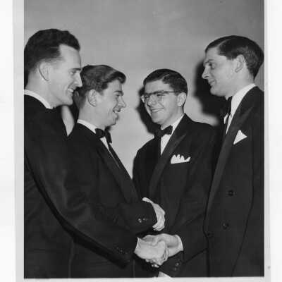 Students from Villiger Debating Society shaking hands with members of debate team from Oxford?