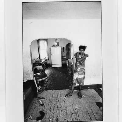 Photograph of woman in her apartment near "The House" or SJC Commune at 17th and Girard Streets in Philadelphia.