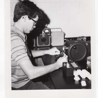 Biology student, Bernard Carlin, working on Crown Gall project in science laboratory, August 1975.
