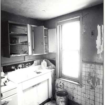 Photo of kitchen in poor condition in apartment near "The House" or SJC Commune at 17th and Girard Streets in Philadelphia.