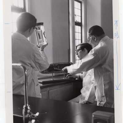 Biology professor, Louis Marks and two students in science laboratory in Barbelin Hall, March 1968.
