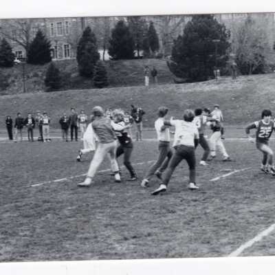Men playing in football intramurals on Finnesey Field.