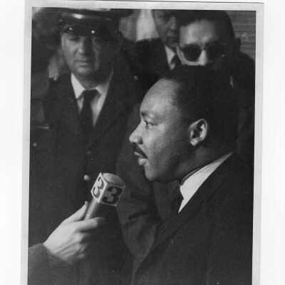 Dr. Martin Luther King, Jr. being interviewed by KYW reporter while visiting Saint Joseph's College, October 26, 1967 to deliver speech in Field House.