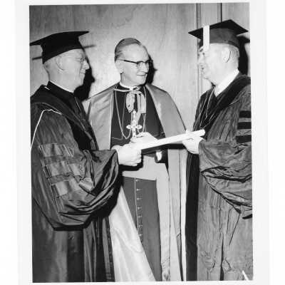 J. Joseph Bluett, S.J. with honorary degree recipients John Cardinal Krol and Augustus Long at 1961 graduation/commencement.