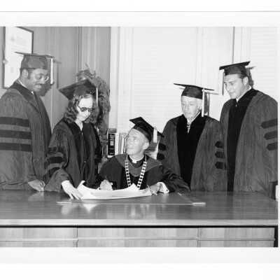 Terrence Toland, S.J., with four honorary degree recipients, Alan D. Ameche, Marcus A. Foster, Max M. Leon, and Violette de Mazia during September 1970 graduation/commencement.