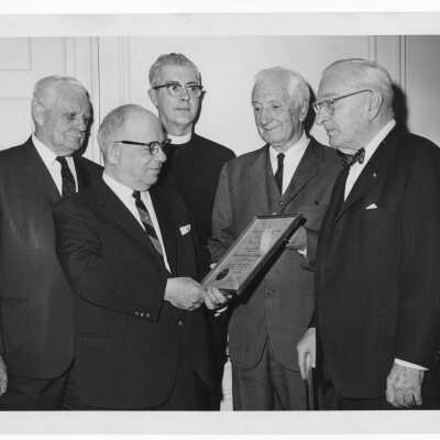 Dr. William N. Parkinson showing Shaffrey award certificate to Dr. Scarano, William F. Maloney, S.J., Mark Bauer, S.J., and Dr.Bernard Widmann, April 12, 1964.