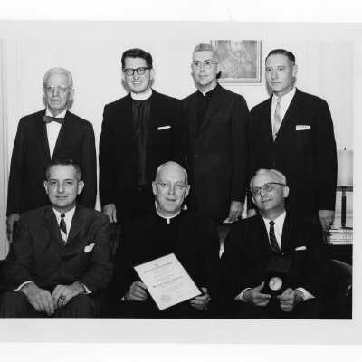 J. Joseph Bluett, S.J. showing 1962 Shaffrey award certificate with William A. Sodeman (recipient), J. Parsons Schaeffer, F.J. MacEntee, S.J., Mark Bauer, S.J., Edmund Brogan, Michael Devine