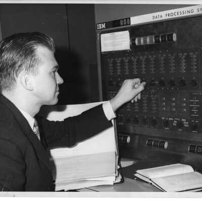 James T. McDonough with IBM 650 computer