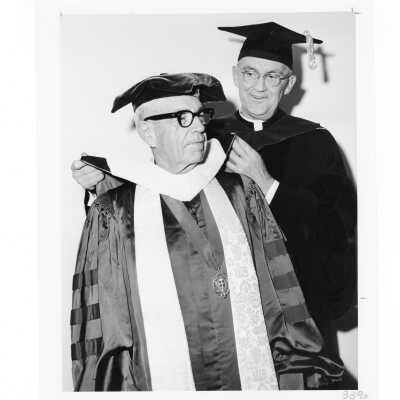 William F. Maloney, S.J., with honorary degree recipient Bishop Fred Pierce Corson, during October 1963 graduation/commencement.