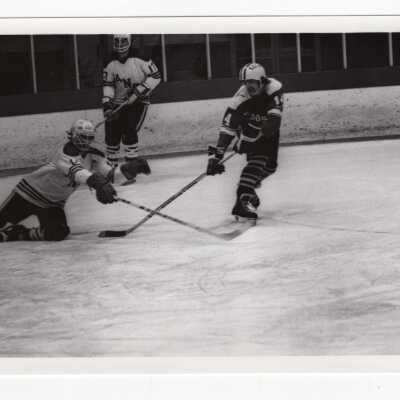 Men's ice hockey team in game.