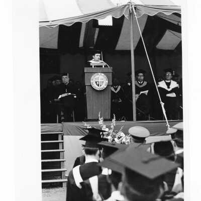 Honorary degree recipient and speaker (Mike Douglas?) addressing graduates during 1968 graduation/commencement.