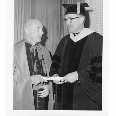 William F. Maloney, S.J., with honorary degree recipient, Monsignor Edward T. Hughes during October 1966 graduation/commencement.