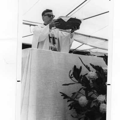 Donald I. MacLean, S.J., at outdoor Mass, c. 1980.