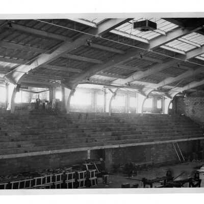Interior view of construction of seating in Field House (Sports Complex).