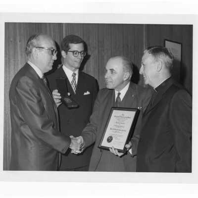 Shaffrey award recipient, Dr. Peter A. Herbut, receiving congratulations from three others, April 19, 1970.
