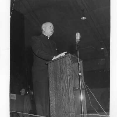Hunter Guthrie, S.J., addressing symposium on Jesuit education as part of centennial celebration, October 27, 1951.