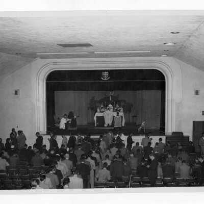 Students attending mass in Flanigan Auditorium.