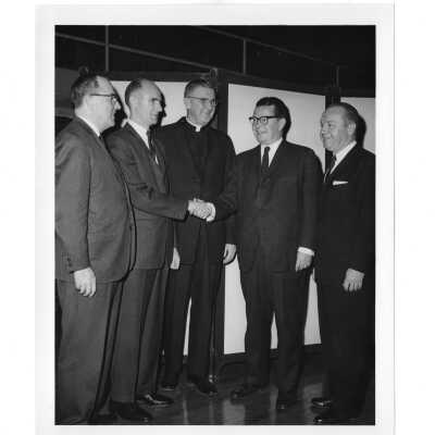 William F. Maloney, S.J., New Jersey Governor Richard J. Hughes (class of 1930) and others during alumni communion supper, February 12, 1964.