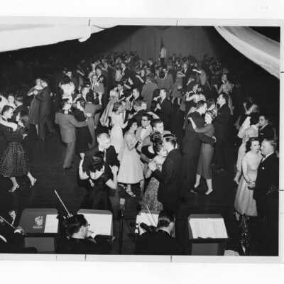 View of orchestra and couples at alumni association dance, November 27, 1959.