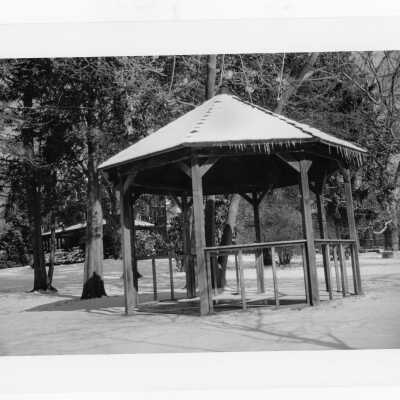 Gazebo of Gest Estate (now Wolfington Center) in winter with snow on ground. [not original structure; original made with tree limbs]