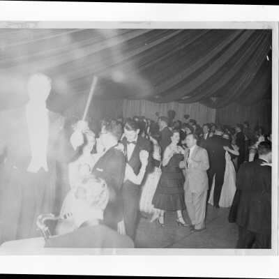 View of band leader and alumni and guests dancing at formal supper dance, 1954.