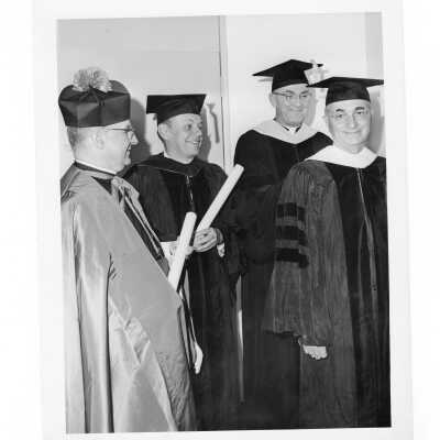 William F. Maloney, S.J., with three honorary degree recipients, Allen H. Wetter, Monsignor Anthony L. Ostheimer, and Richard C. Bond at October 1964 commencement/graduation.