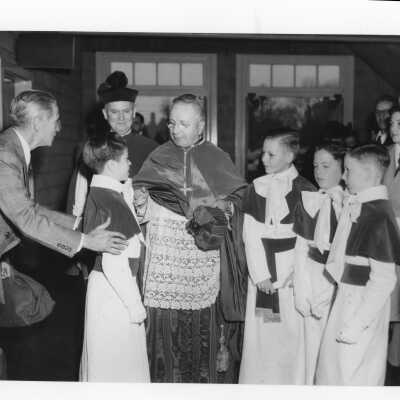 Altar boys meeting Monsignor Vincent Burns and Amleto Giovanni Cicognani pontifical mass for centennial celebration held in Field House.