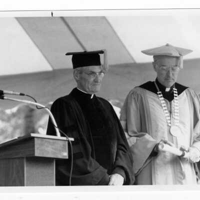 Donald I. MacLean, S.J. with honorary degree recipient, Michael J. Smith, S.J. during 1985 graduation/commencement.