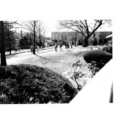 Students walking near Campion Hall and Bookstore.