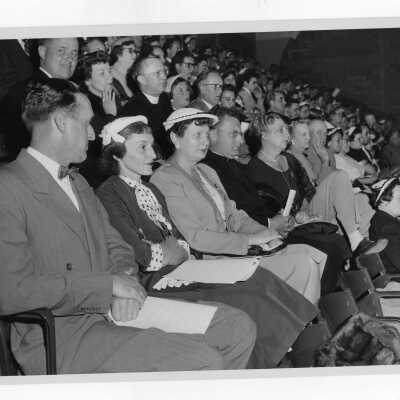 Audience listening to Glee Club concert (possibly Mother's Day concert). Included in audience are Edward G. Jacklin, S.J. and Matthew Sullivan, S.J.