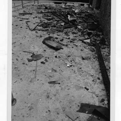 Exterior view of debris on ground outside of Simpson Hall after fire.