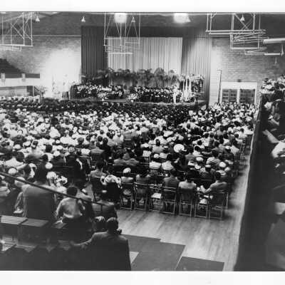 View of 1953 graduation/commencement ceremony in Field House.