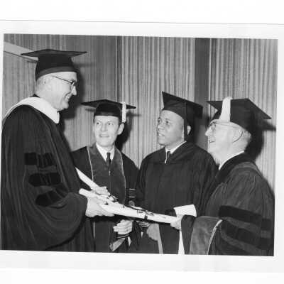William F. Maloney, S.J., with three honorary degree recipients, William F. Kellow, M.D., Lawrence W. Pierce, and Joseph F. Burke during September 1967 graduation/commencement.