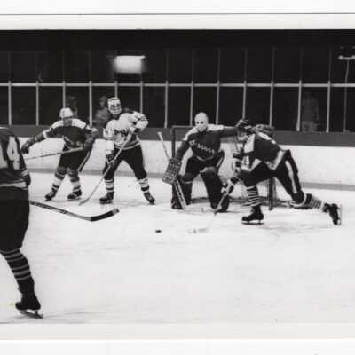 Men's ice hockey team in game.