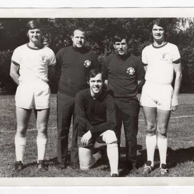 Men's soccer team members with Coaches Jack Ruggeri and Ed Blaney, 1974.