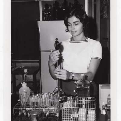 Biology student, Rosemary DePaoli, working on Crown Gall project in science laboratory, August 1975.